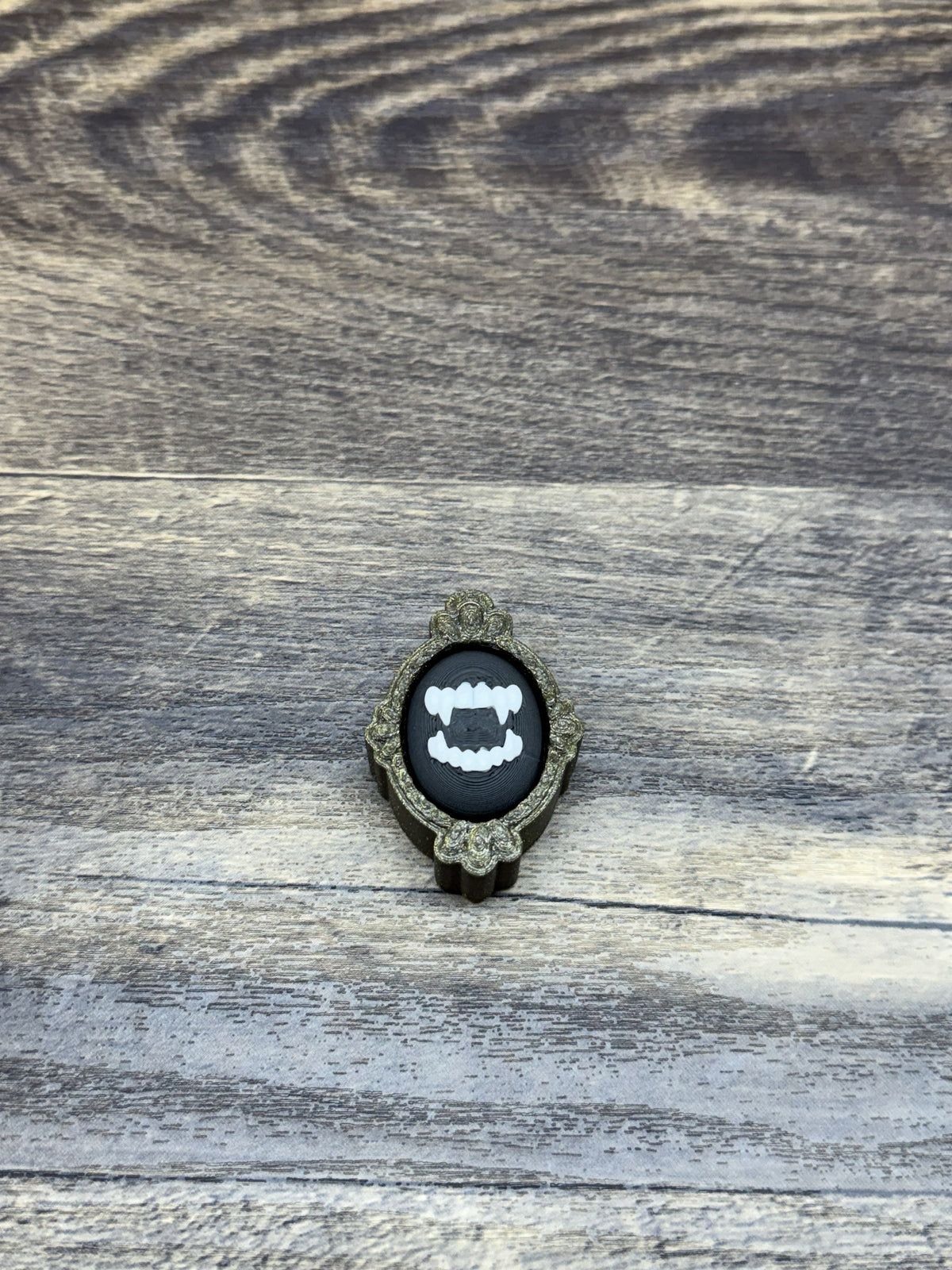 Framed Fangs Clicker